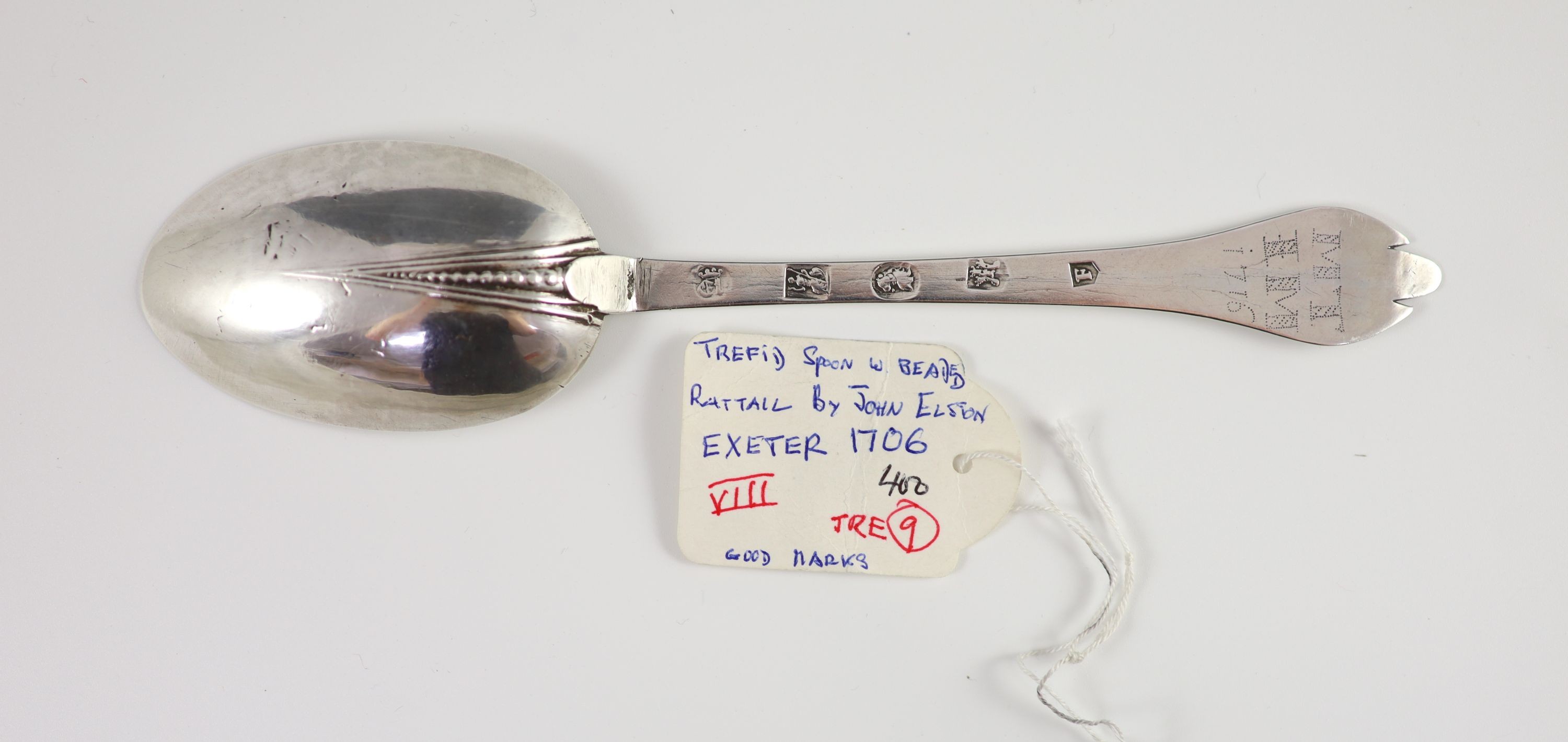 A Queen Anne West Country silver trefid spoon, inscribed ‘MT’ over ‘IM, over ‘1715’, by John Elston, Exeter, 1706, 20cm long, 1 oz.